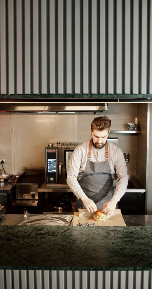 Cooks working a restaurant kitchen pass
