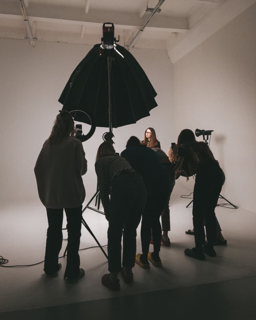 A small studio team working a photo shoot